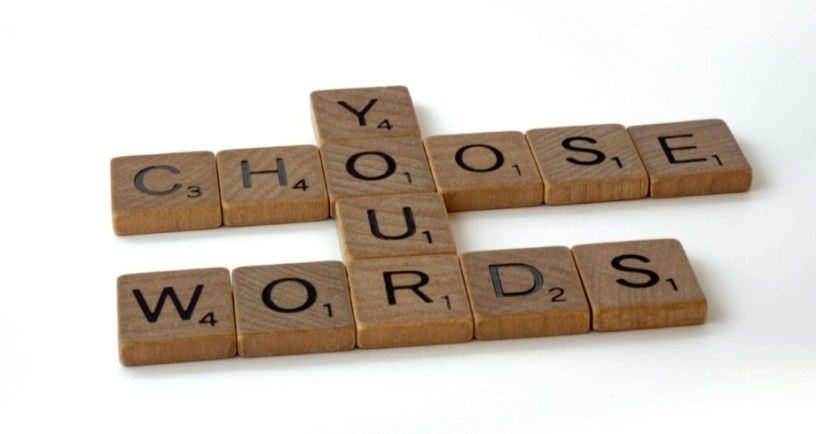 Scrabble tiles saying "You choose your words"