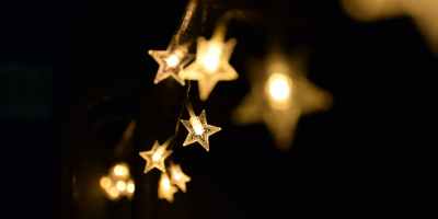 shallow focus photography of yellow star lanterns