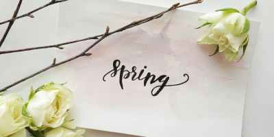 white printed paper with four white roses