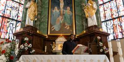 a priest celebrating a holy mass