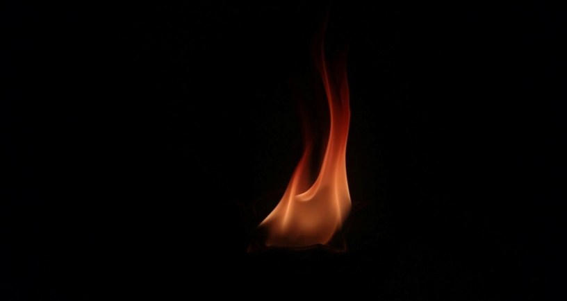Picture of a single flame, illustration for short story "The Ember in Sarah Whitcomb" by Mariah Boland. Photo by Gaurav Diwan: https://www.pexels.com/photo/close-up-shot-of-flames-6652543/