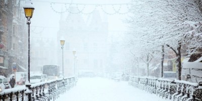 Snowy road in city. Photo by Filip Bunkens/Unsplash. https://unsplash.com/photos/road-covered-by-snow-near-vehicle-traveling-at-daytime-R5SrmZPoO40