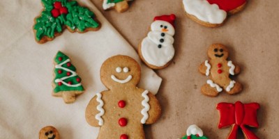 Christmas cookies on table. Photo Credit: Isabela Kronemberger on Unsplash. https://unsplash.com/photos/a-table-topped-with-lots-of-decorated-cookies-bbkqplzRVJw