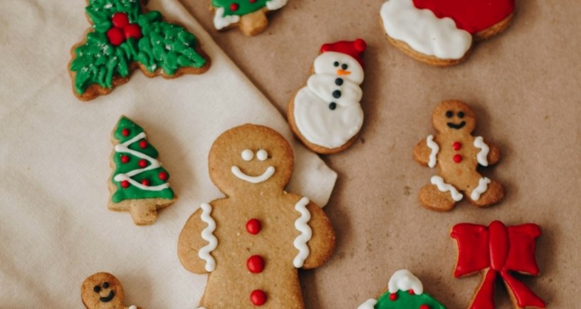 Christmas cookies on table. Photo Credit: Isabela Kronemberger on Unsplash. https://unsplash.com/photos/a-table-topped-with-lots-of-decorated-cookies-bbkqplzRVJw