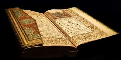 Photo by Enes Salih Gökçek: https://www.pexels.com/photo/open-decorative-book-with-arabic-script-against-a-black-background-13208790/